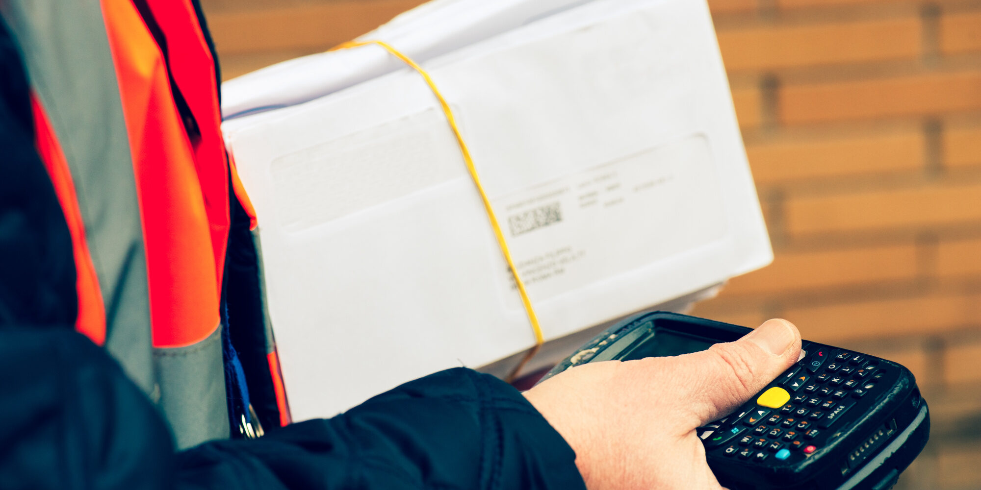 postman scanning mails before delivering them