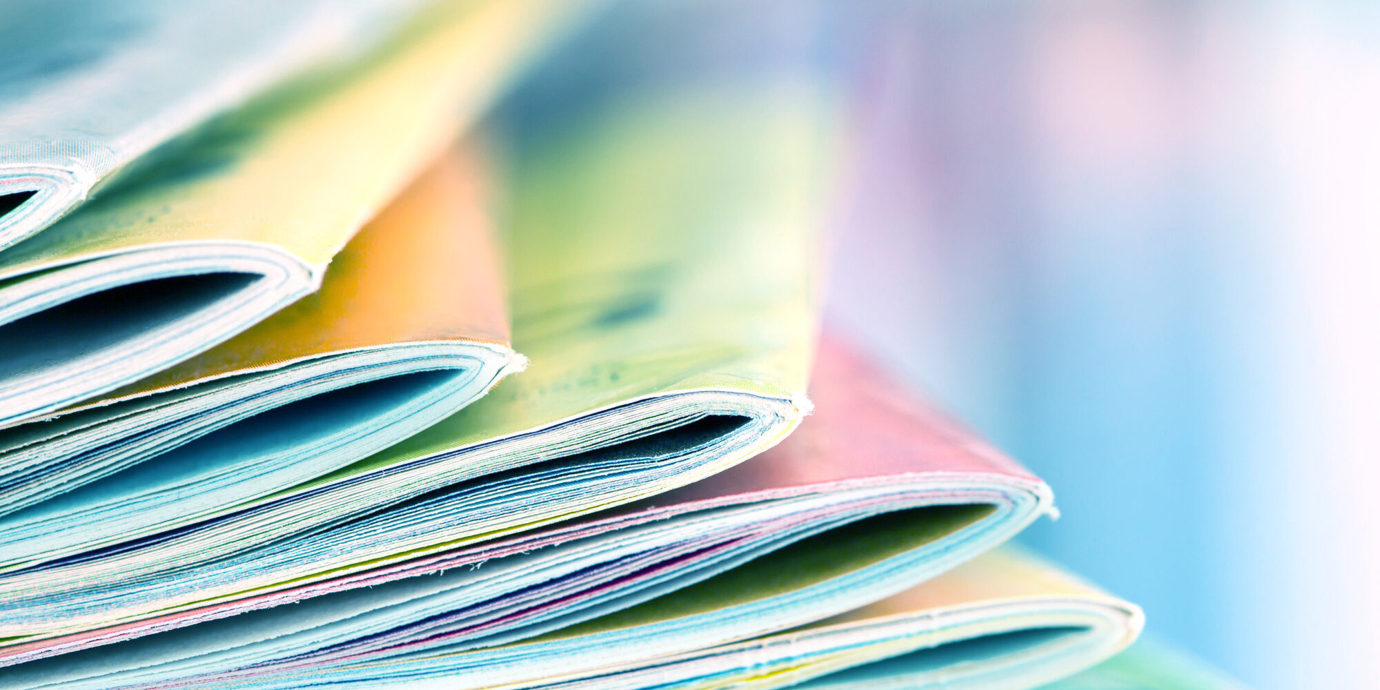 Close up edge of colorful magazine stacking