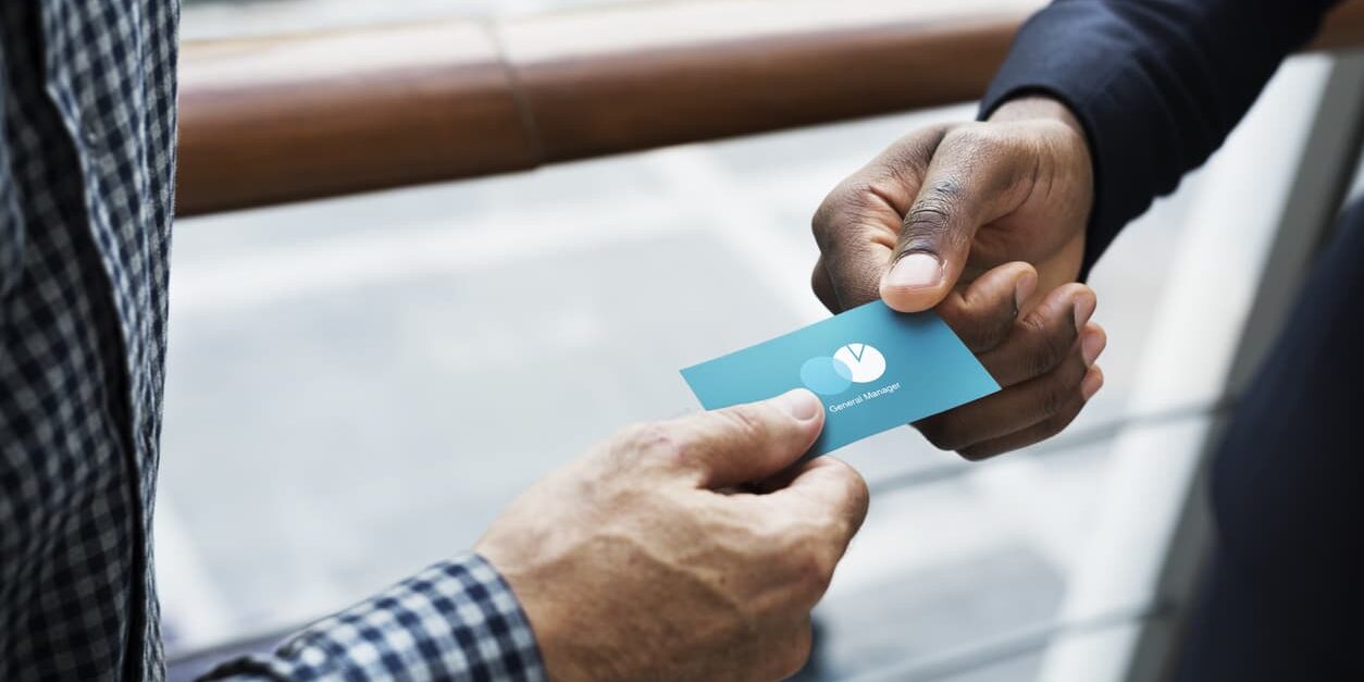 Business people exchanging a business card Branding Business Cards