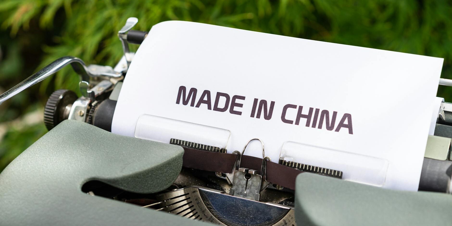 1742125343171×596721201781788000-feature Image of old printer with paper spelling "made in China" Catdi Houston printing shop