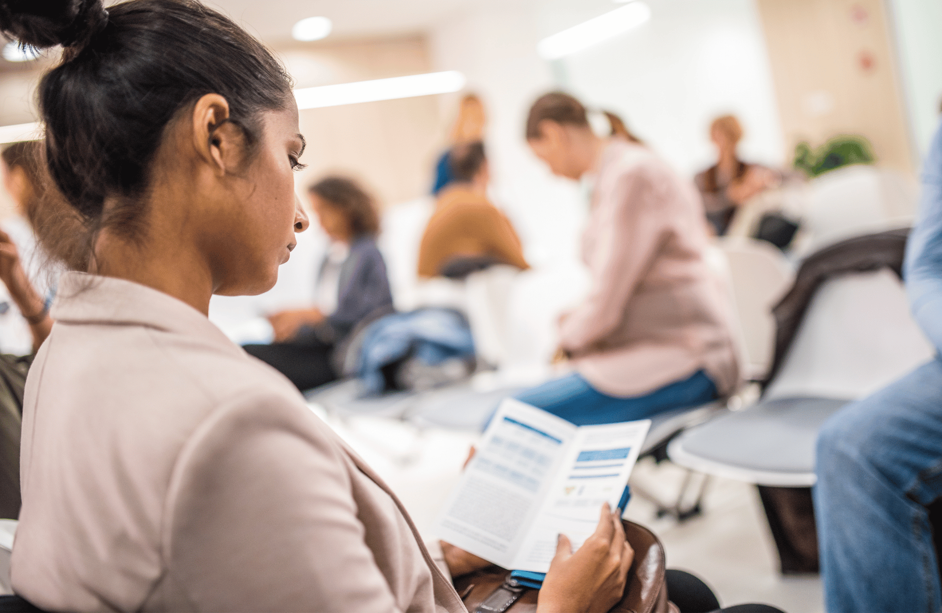 woman at business conference in Houston reading flyer -Catdi, Houston printing experts